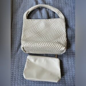 Brand new never used white woven shoulder bag with interior pouch.